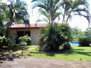 There's a spacious parking area within the gate from which the pool can be seen on the other side of the house.